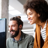 woman and man behind computer